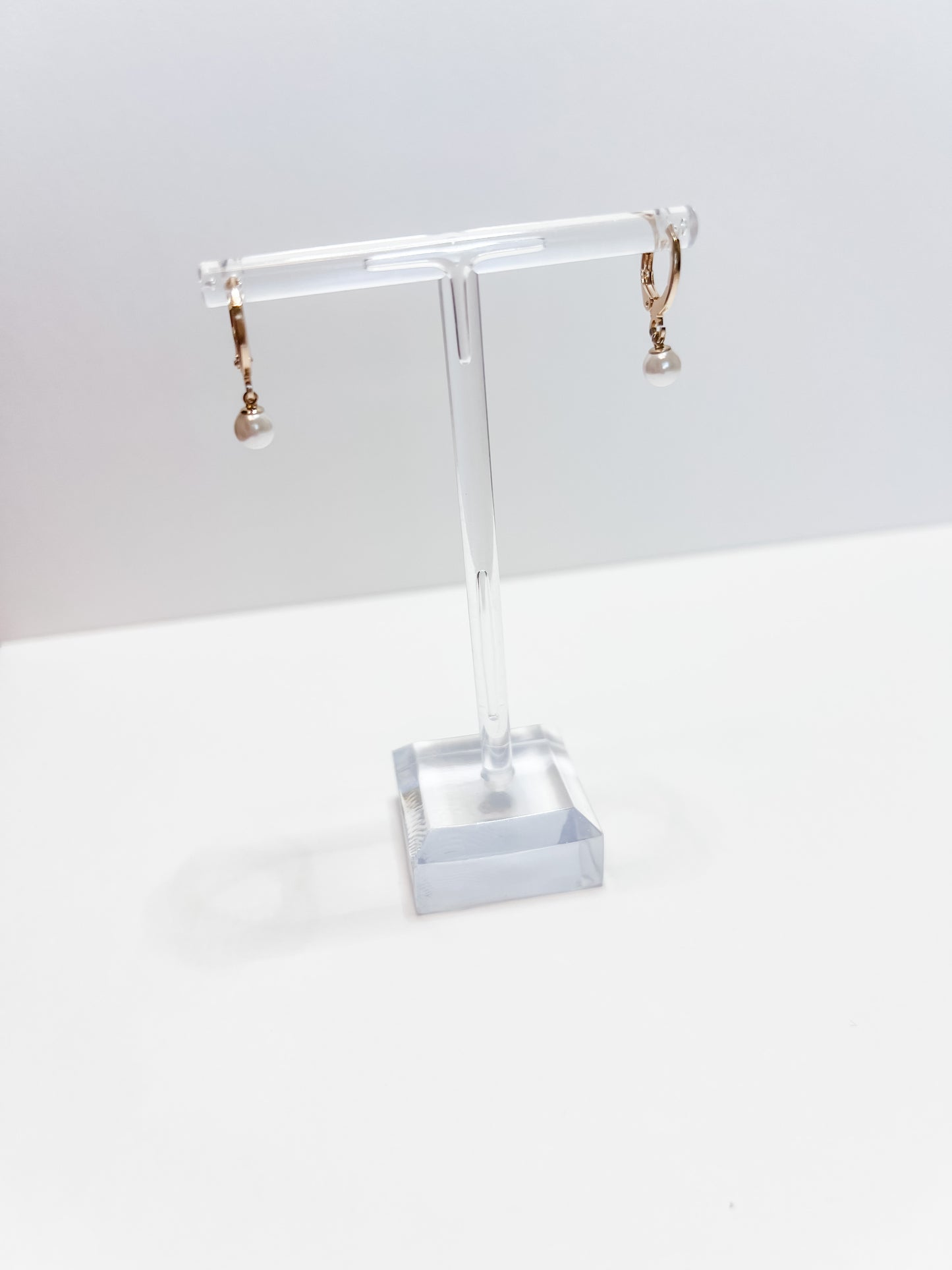 DARLA | gold-filled lever-back earrings with mother of pearl daisy accent