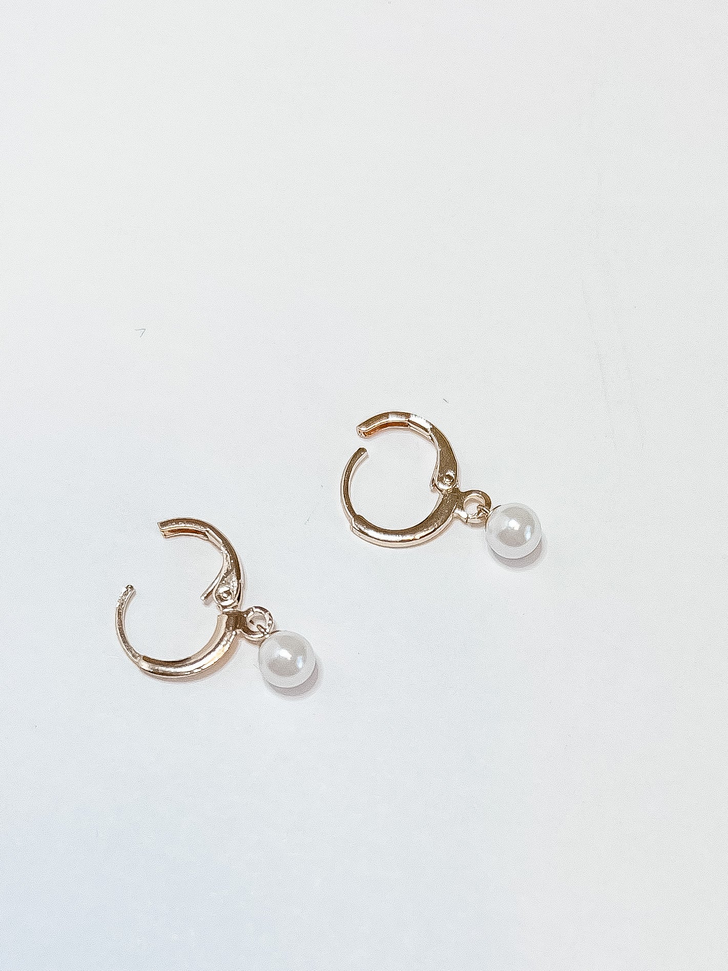 DARLA | gold-filled lever-back earrings with mother of pearl daisy accent