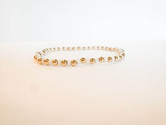 Cream and gold-filled beaded bracelet