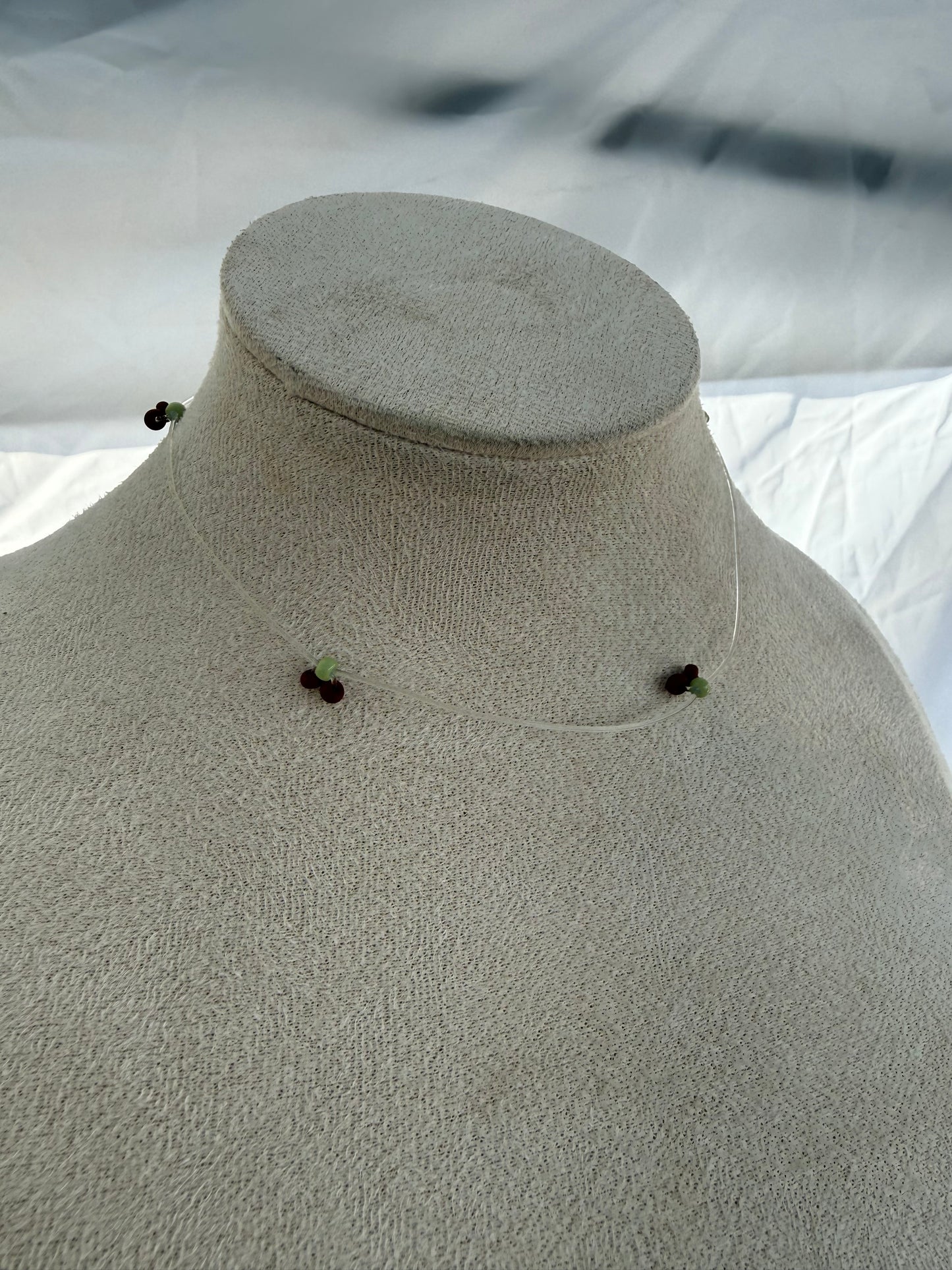 Invisible cherry stretch necklace
